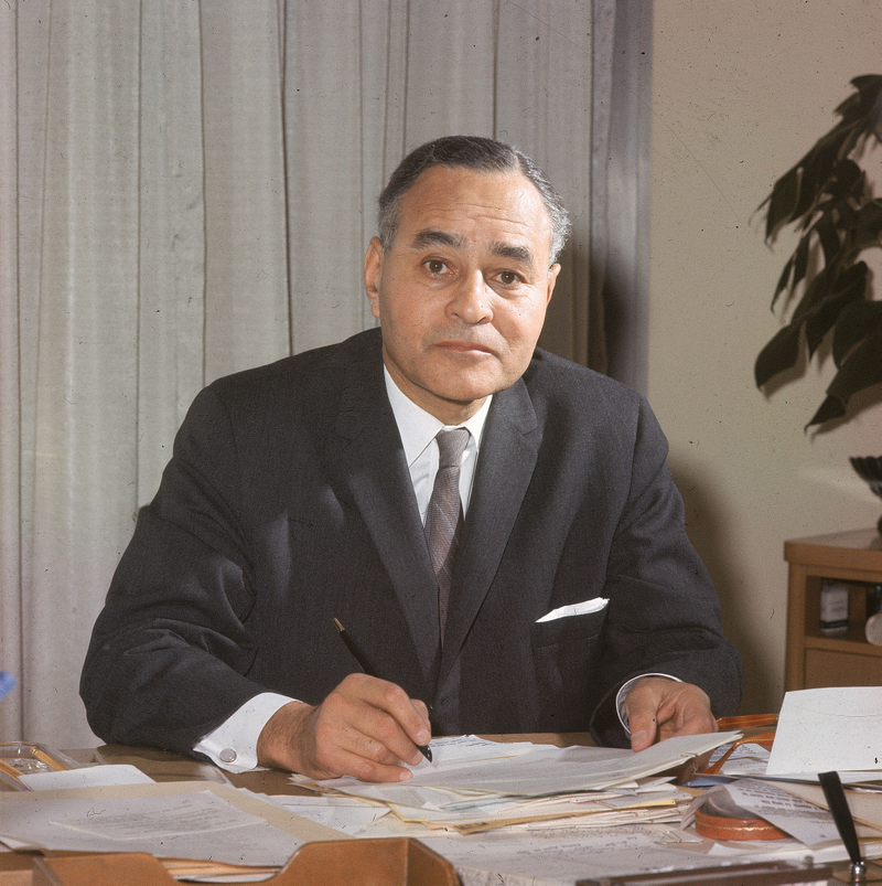 Ralph Bunche, United Nations Undersecretary General, signs papers at his desk in his office at the U.N. headquarters in New York City, April 26, 1963.